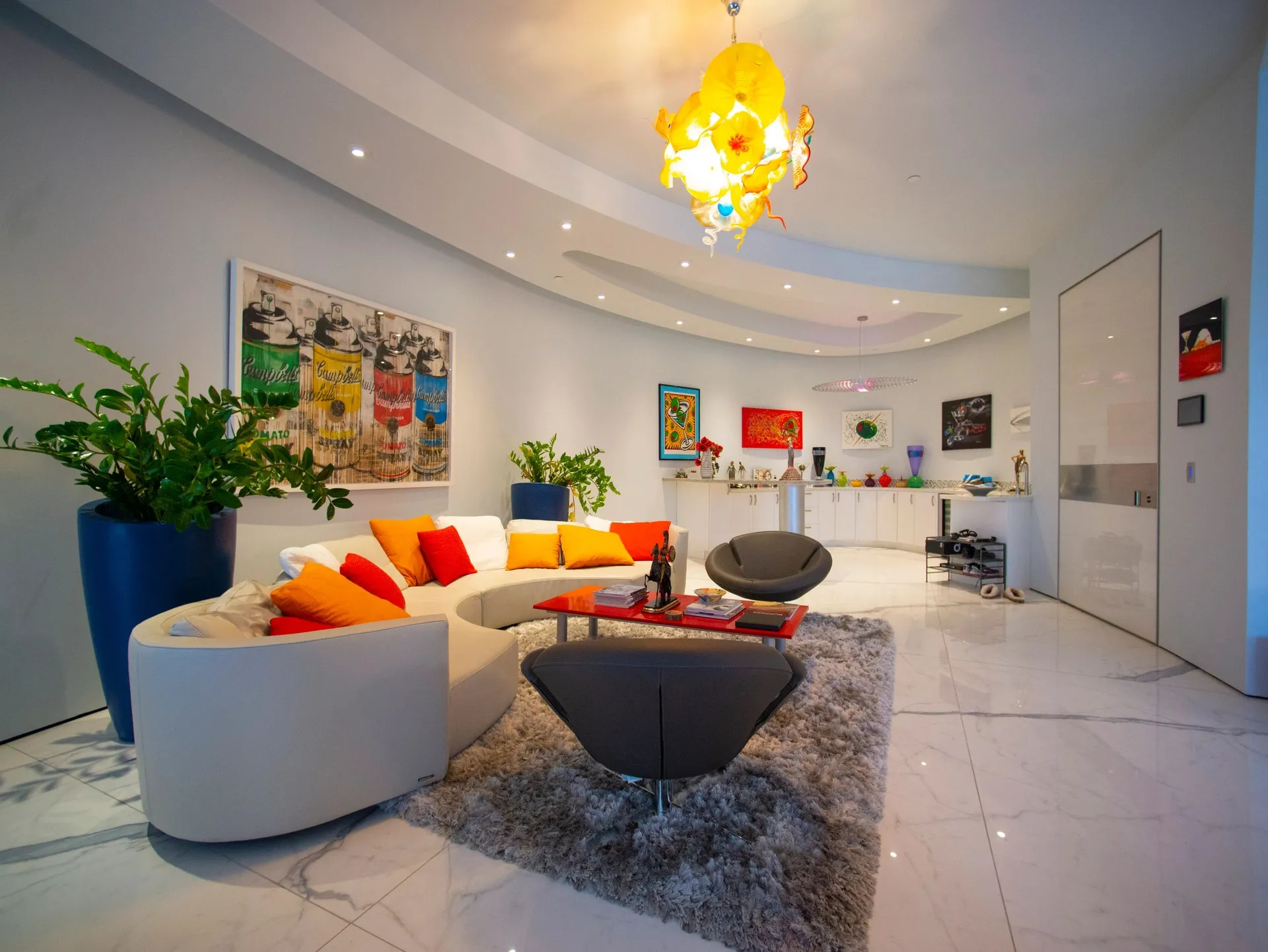 A front room brings art, color, and everyday life into one composed interior.