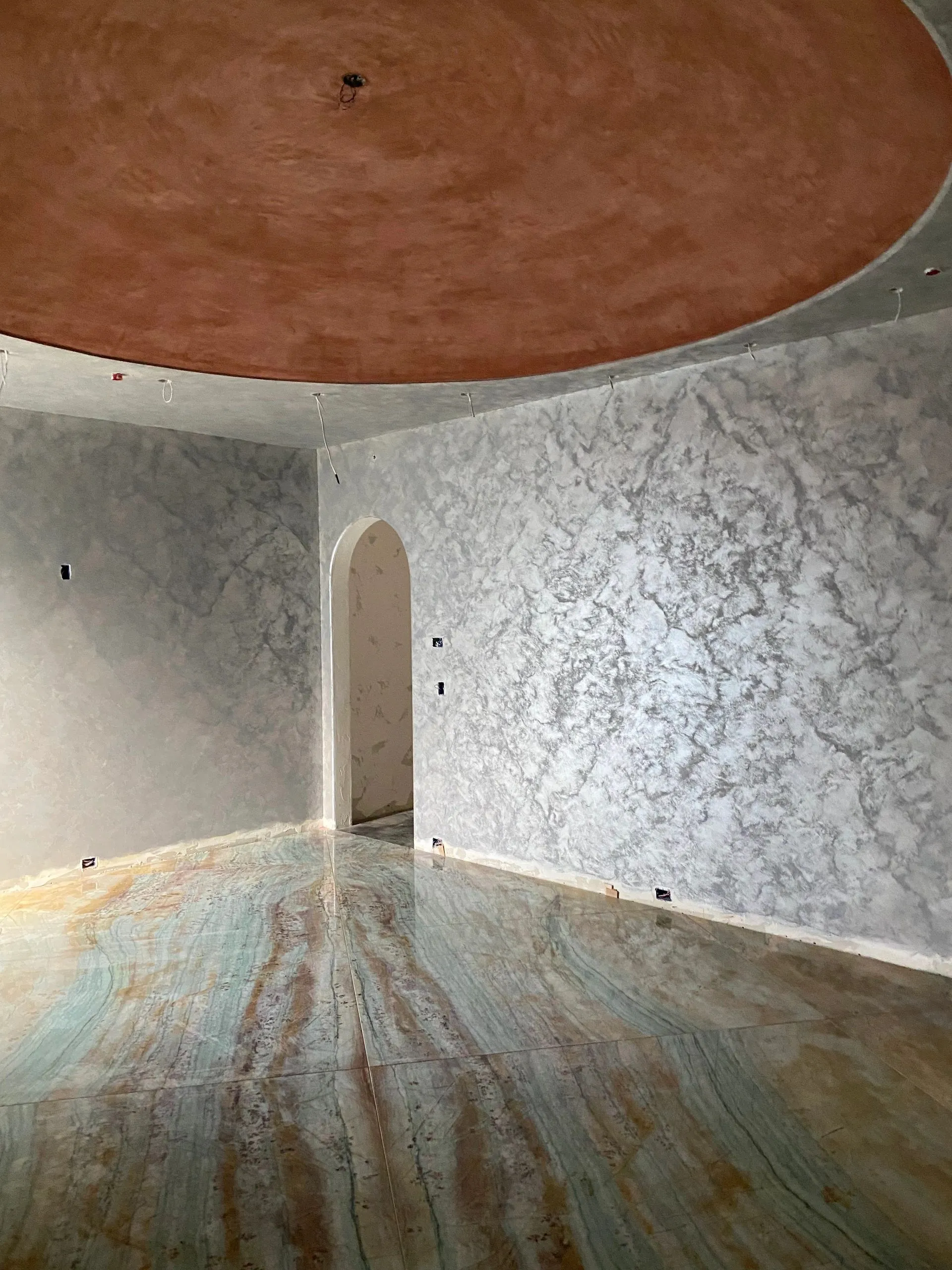 An arched interior turns a passage into a place worth lingering in.